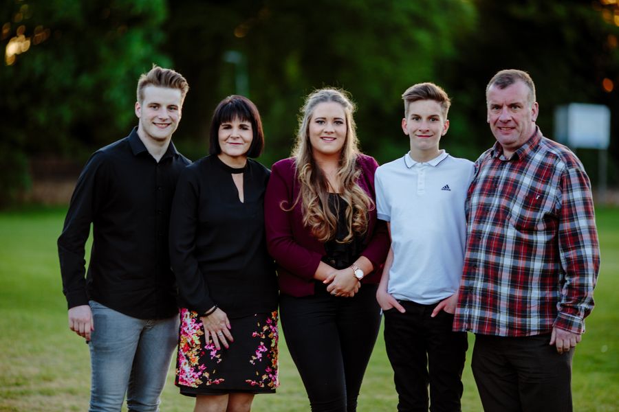 A recent portrait of all five of the family together outdoors